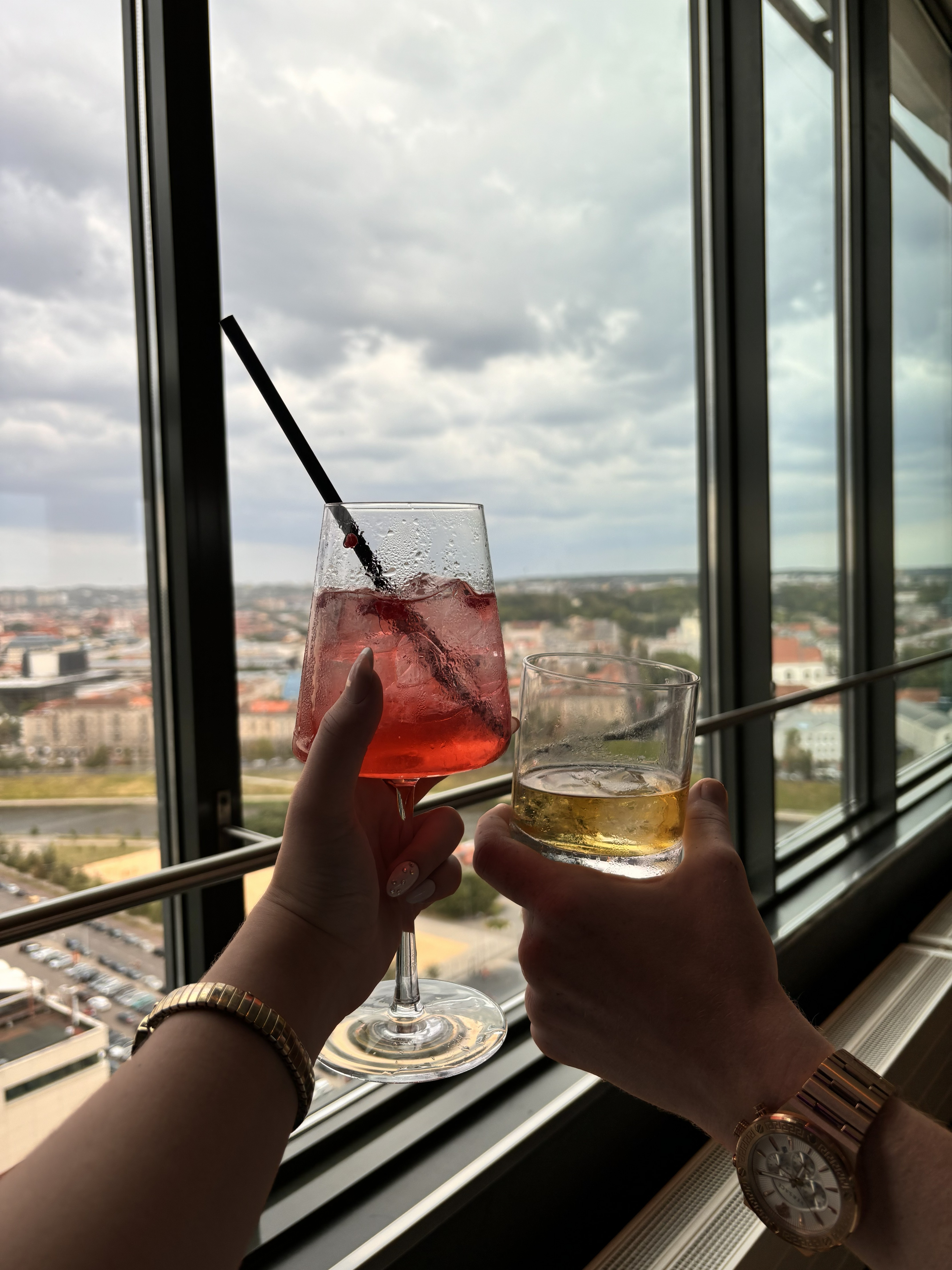 Skybar drinks with the whole city stretched out underneath us, which is exactly how I want every travel day to end.